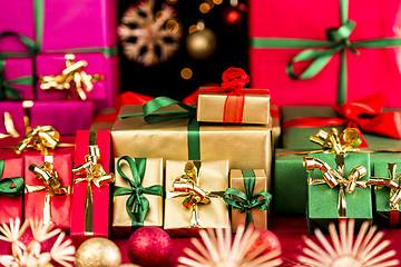 Image showing Many Christmas Presents Grouped by Color