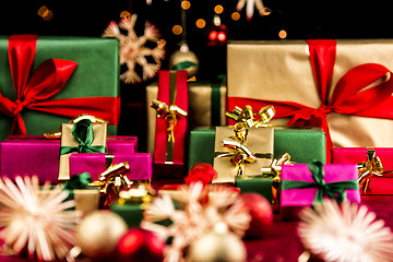 Image showing Plenty of Xmas Gifts in Red, Gold and Green