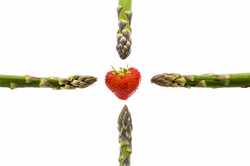 Image showing Four Asparagus Spears and One Strawberry