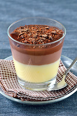 Image showing Cup of chocolate and vanilla pudding