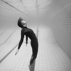 Image showing Female diver suspended in space underwater