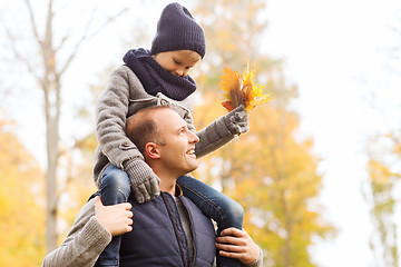 Image showing happy family having fun in autumn park