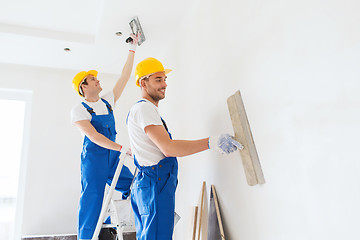 Image showing group of builders with tools indoors