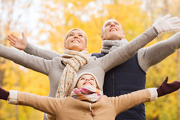 Image showing happy family having fun in autumn park