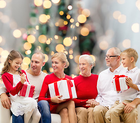 Image showing smiling family with gifts