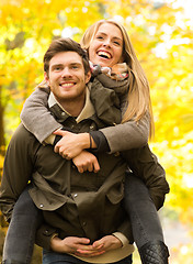 Image showing smiling friends having fun in autumn park