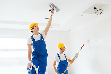 Image showing group of builders with tools indoors