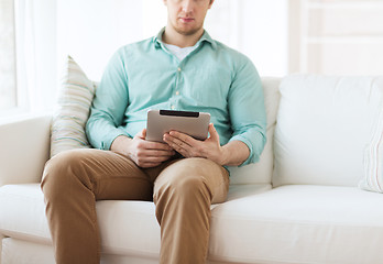 Image showing close up of man with tablet pc computer at home