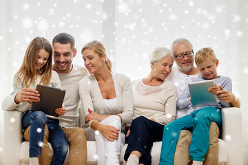 Image showing smiling family with tablet pc computers at home