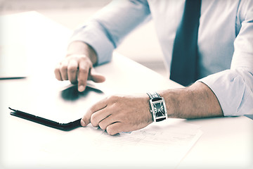 Image showing businessman with tablet pc in office