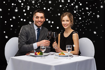 Image showing smiling couple at restaurant