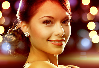 Image showing woman in evening dress wearing diamond earrings