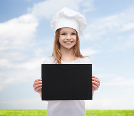 Image showing little cook or baker with blank black paper