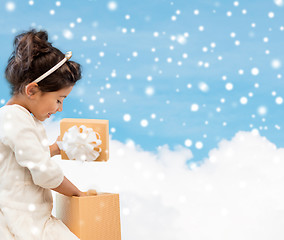 Image showing smiling little girl with gift box