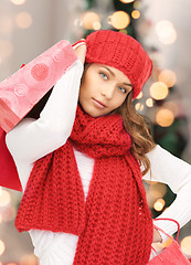 Image showing smiling young woman with shopping bags