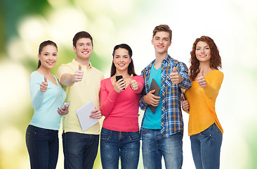 Image showing group of teenagers with smartphones and tablet pc