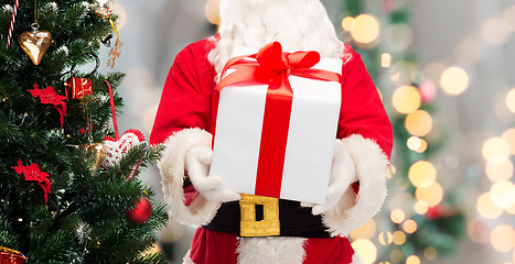 Image showing man in costume of santa claus with gift box