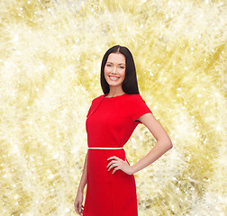 Image showing smiling woman in red dress