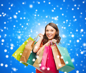 Image showing smiling woman with colorful shopping bags