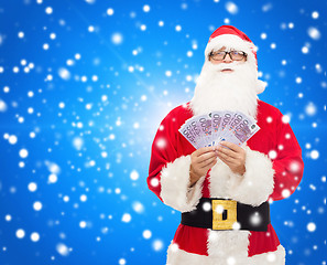 Image showing man in costume of santa claus with euro money