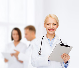 Image showing female doctor with stethoscope and tablet pc