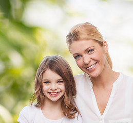 Image showing smiling mother and little girl