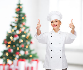 Image showing smiling female chef showing thumbs up