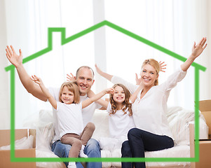 Image showing smiling parents and two little girls at new home