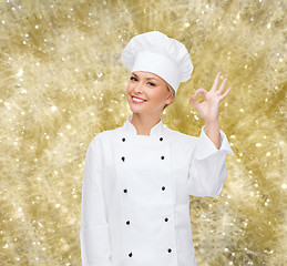 Image showing smiling female chef showing ok sign