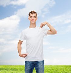 Image showing smiling young man in blank white t-shirt