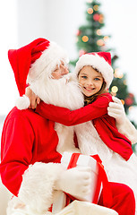 Image showing smiling little girl with santa claus