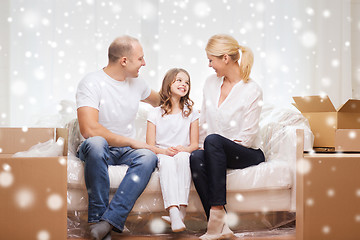 Image showing smiling parents and little girl at new home