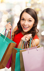 Image showing smiling woman with colorful shopping bags