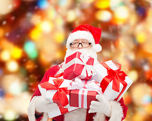 Image showing man in costume of santa claus with gift boxes