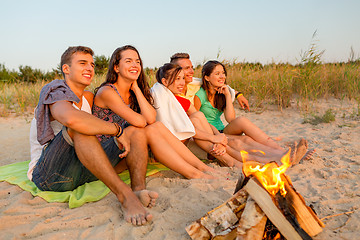 Image showing smiling friends in sunglasses on summer beach