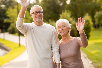 Image showing senior couple hugging in city park