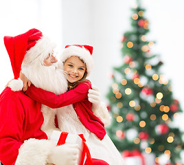 Image showing smiling little girl with santa claus