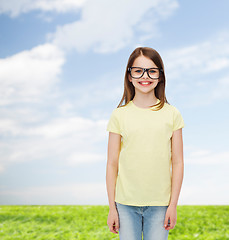 Image showing smiling cute little girl in black eyeglasses