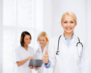 Image showing smiling female doctor showing thumbs up