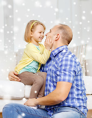 Image showing smiling father and daughter hugging at home