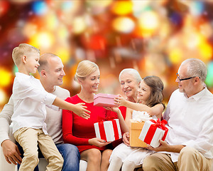 Image showing smiling family with gifts