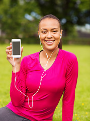 Image showing smiling african american woman with smartphone