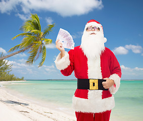 Image showing man in costume of santa claus with euro money