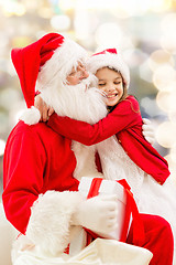 Image showing smiling little girl with santa claus