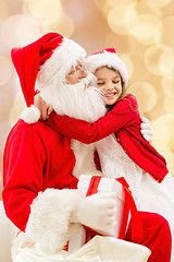 Image showing smiling little girl with santa claus