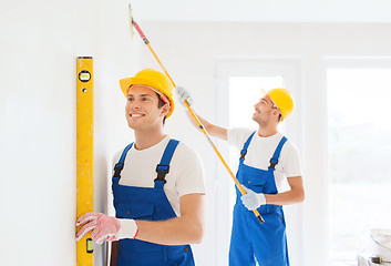 Image showing group of builders with tools indoors