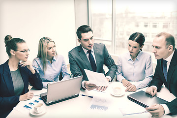 Image showing business team with laptop having discussion