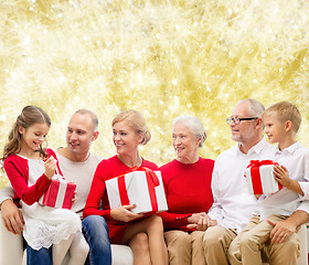 Image showing smiling family with gifts