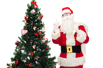 Image showing santa claus with bag and christmas tree