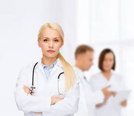 Image showing serious female doctor with stethoscope